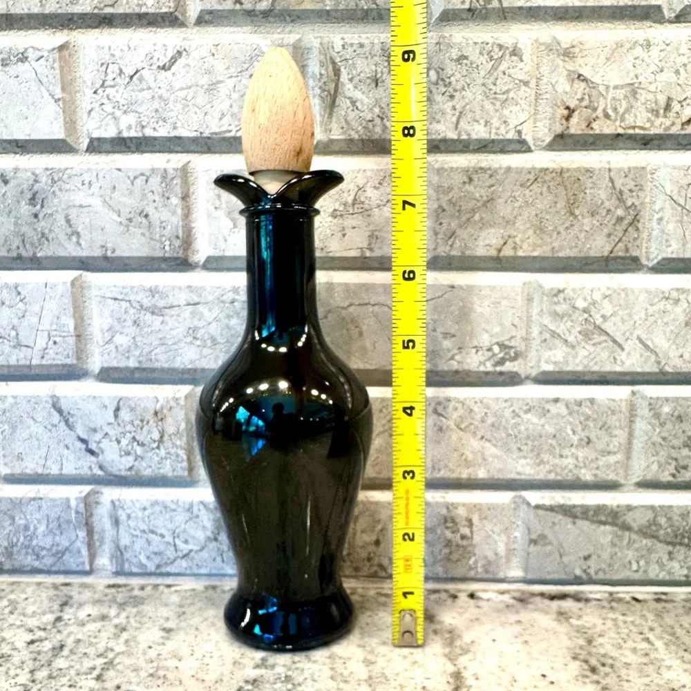 Tulip shaped dark green oil/vinegar cruet with wooden stopper